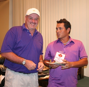 Division 1 winner Doug Lynch, left, receives his prize.