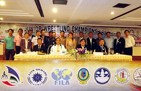 Pattaya City officials, led by deputy mayor Ronakit Ekasingh, and administrators of the Thailand Wrestling Association (TWA) pose for a photo at a press conference held August 9 at the Ambassador City Hotel, to announce the upcoming World Youth Wrestling Championships.