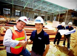Russell Pang, Country Business Development Director of CEVA Logistics (Thailand) Limited (CEVA), left, and Patan Somburanasin, General Manager of TICON Logistics Park Co., Ltd (TPARK), inspect progress at the construction site of CEVA Logistics new facility in Laemchabang.