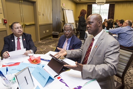 Ashok Mirchandani, Africa Regional PolioPlus Committee Chair, Benin; Past RI President Jonathan Majiyagbe, Advisor to the International PolioPlus Committee, Nigeria and Olayinka H. Babalola, End Polio Now Zone 20A Coordinator, Nigeria discuss the issues at hand.