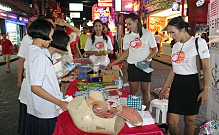 Students learn about reproductive systems on Walking Street.