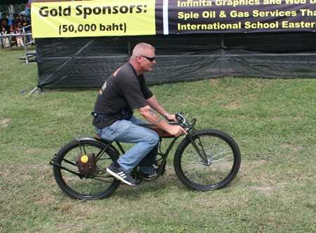 Ronny pulls in on a replica of the earliest motorcycles, when they were more like bicycles with small motors.
