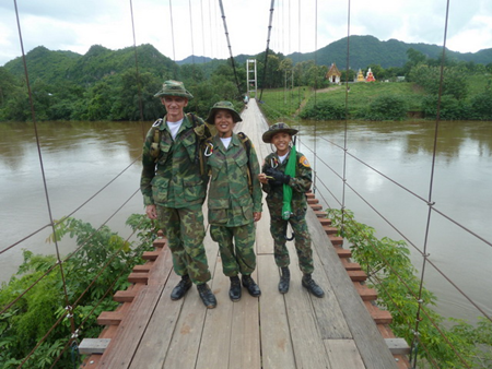 Suspension Bridge over the North River Kwai. Left to Right: Unit Commander Rad, PFC Bret & leader Nok Mays.
