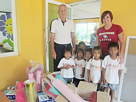 Melissa, William and children inspect the goods.