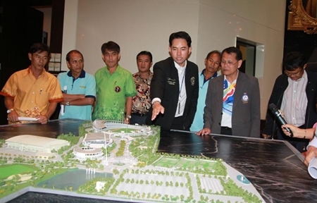 Mayor Itthiphol Kunplome and Maj. Gen. Osoth Bhavilai look over plans to renovate the Pattaya Indoor Sports Arena to make it the nation’s main venue for disabled athletes. 