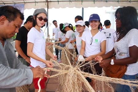 Holiday Inn Pattaya and Ibis Pattaya Hotel employees make artificial trees from ropes to be dropped in the Naklua Reefs Preservation area.