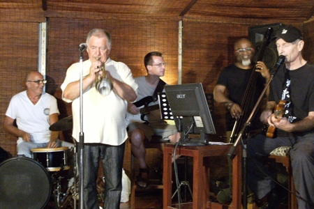 International artists (left to right) Peter Couling on drums, Paul Erik on trumpet, Michael Sternbacher on guitar, Jair-Rohm Parker Wells on bass, and Thomas Reimber on guitar - synthesizer, jamming the night away at the Jazz Pit on Soi 5. 