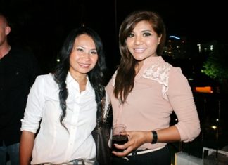 Smiling property consultants Piyanuch Puangkhamnuan (left) and Prapai Sema (right) from Enjoys Property Co., Ltd.