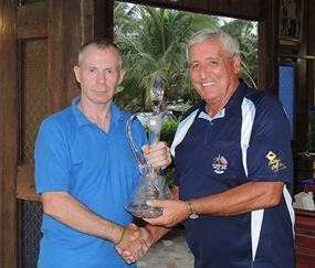 JingJo, the late Frank O’Neill’s son, left, presents the newly named trophy to George Bishop. 