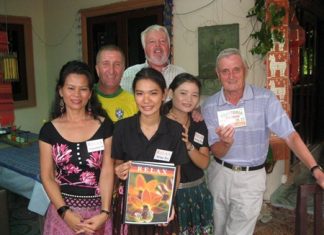 Tuesday winners pose with the staff at The Relax Bar.