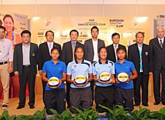 City officials, tournament organizers and sponsors pose for a photo at a press conference held to announce the 23–28 October Beach Volleyball championship.