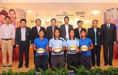 City officials, tournament organizers and sponsors pose for a photo at a press conference held to announce the 23–28 October Beach Volleyball championship. 