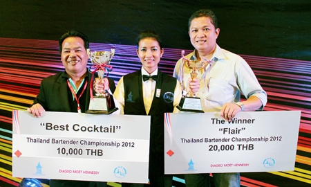 Kanda Namboran (middle) celebrates with her colleagues Luechai Numrat (left) and Pin Krasang after winning two major awards at the Thailand Bartender Championship in BITEC, Bangkok