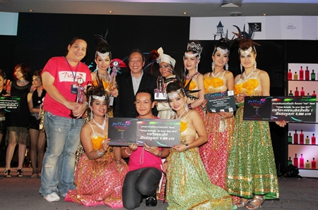 Dusit Thani Pattaya GM Chatchawal Supachayanont (back row 3rd left) congratulates members of The Honeybees for winning the Ms Bartender award in the recently-concluded Pattaya and the East Bartender Contest 2012 participated in by hotels and resorts in all the Eastern Seaboard and held in the Napalai Ballroom of the resort. 