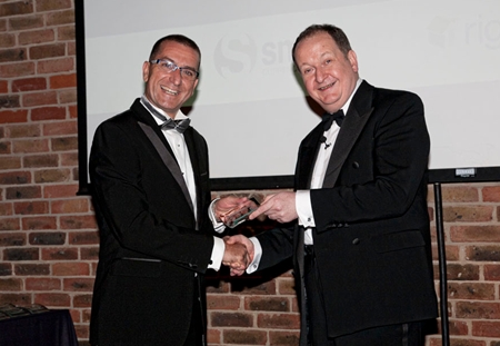 Miki Haim (left), Managing Director of Matrix Developments, collects the OPP award at a gala ceremony in London.