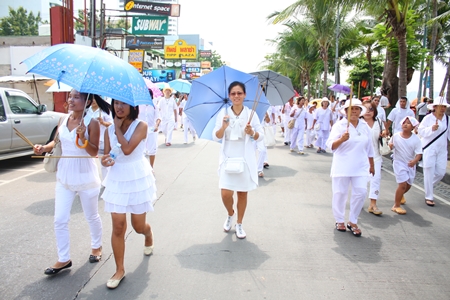 Marchers dress in white to signify purity and cleansing of their bodies and souls.