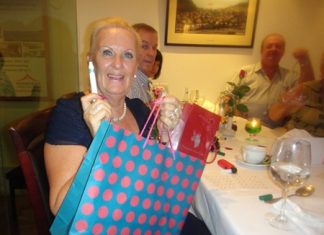 Brenda Bradbrooke with her prize and her lucky pen.