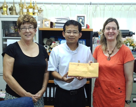 PILC president Ann Winfield, Camillian Center director Father Peter, and PILC welfare chair Helle Rantsen with the club’s donation to the Center. 
