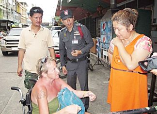 Anna Julun explains to police through a translator how she was robbed by two cowardly thieves.
