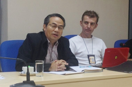 Nitiwat Pattanasarn (left) talks with Foreign Tourist Police Assistants, as acting FTPA group leader Wayne Walton (right) looks on. 