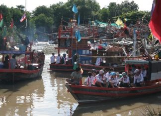 The environmentally minded riders park their bicycles and board vessels that will take them out to sea to sink 20 fish traps, made from bamboo sticks and coconut stalk, to be fish homes, along with 500 seaweed balls.