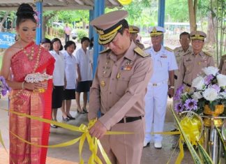 Royal Thai Navy Vice Adm. Chainarong Charoenrak cuts the ribbon opening Sattahip School’s new library building.