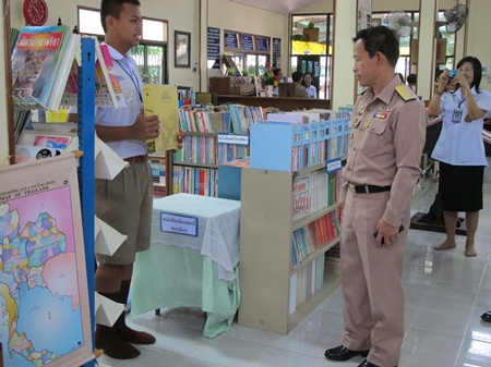 Vice Adm. Chainarong Charoenrak is given a tour of the new library. 