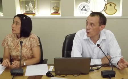 Pra-ornsuda Sukrakanchana (left), coordinator of the PHPT research project, looks on as Gonzague Jourdain (right), speaks to local health workers at City Hall. 