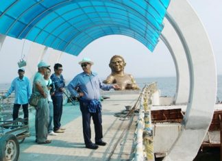 Officials inspect the unfinished new pier, which is still a mess, whilst making the decision to close the dangerously decrepit old pier.