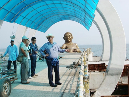 Officials inspect the unfinished new pier, which is still a mess, whilst making the decision to close the dangerously decrepit old pier.