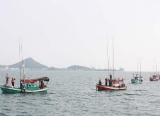 Navy officials bring in the boats illegally stocked with Cambodian fishermen.
