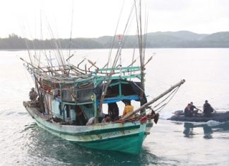 The Royal Thai Navy guides one of two illegal Vietnamese fishing boats into the harbor.