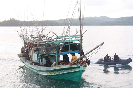 The Royal Thai Navy guides one of two illegal Vietnamese fishing boats into the harbor. 
