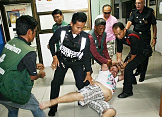 Police struggle to contain the drunken Belgian.