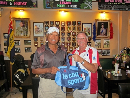 The Scribe, right, presents the MBMG Group Golfer of the Month award to Joel Flor.