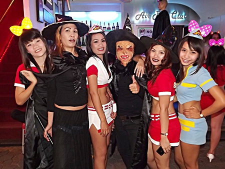Pattaya put on its scariest face as tourists and residents alike haunted hotels, restaurants and nightlife districts to celebrate Halloween. Shown here, mistresses of good and evil both scare and entice creatures of the night on Walking Street.
