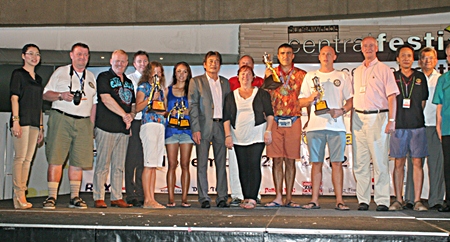 Winners and sponsors gather on stage for the 9th Rotary Pattaya Cross Bay Charity Swim award presentation and closing ceremony.
