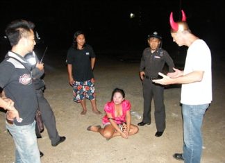 Police happened to be on the spot when transvestite Chaiyos Muenkhumlue (seated) stole money and passport from Stephen David Perry (right).