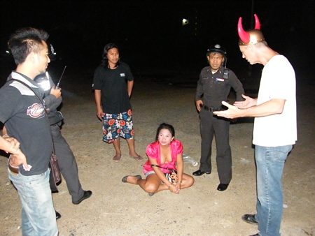 Police happened to be on the spot when transvestite Chaiyos Muenkhumlue (seated) stole money and passport from Stephen David Perry (right). 