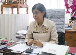 Jintana Maensurin, director of the Pattaya Education Office, with one of the new tablet computers front right on her desk.