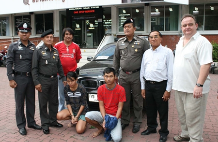 Sunisa Kerdnaikaew and Rungroj Osha (on knees) have been remanded to custody for stealing Michael Procher’s (right) BMW.