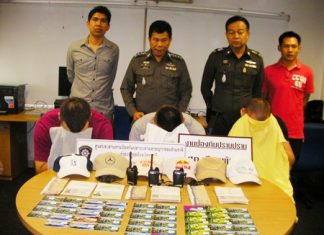 Suspects Anatolee Bosee, Robert Esaak and Lukkas Zimanski hide their faces during the police press conference.