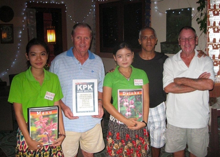 Tuesday’s winners pose with the staff at The Relax Bar. 