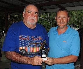 Paul Kelly (left) is presented with his medal trophy by the sponsor, Greg Hirst of DeVere.