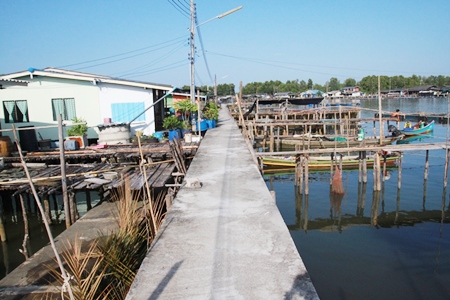 The only land is a strip of footpath in front of homes constructed by the local government.