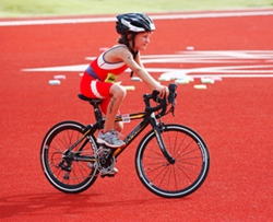 Determined: TSLC IronKids Phuket focuses on triathlon racing, with children running, swimming and cycling to compete.