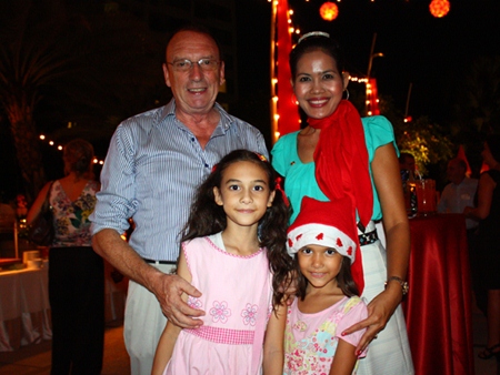 Anthony and Fah pose for a family photo with their daughters, Selina and Angeline Collier.