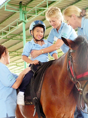 The riders may overcome fears, learn trust and interact socially with their helpers.