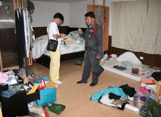 Police inspect the scene of the crime.