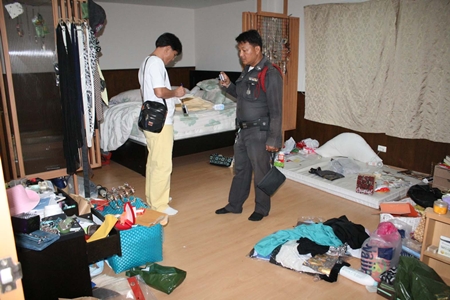 Police inspect the scene of the crime. 